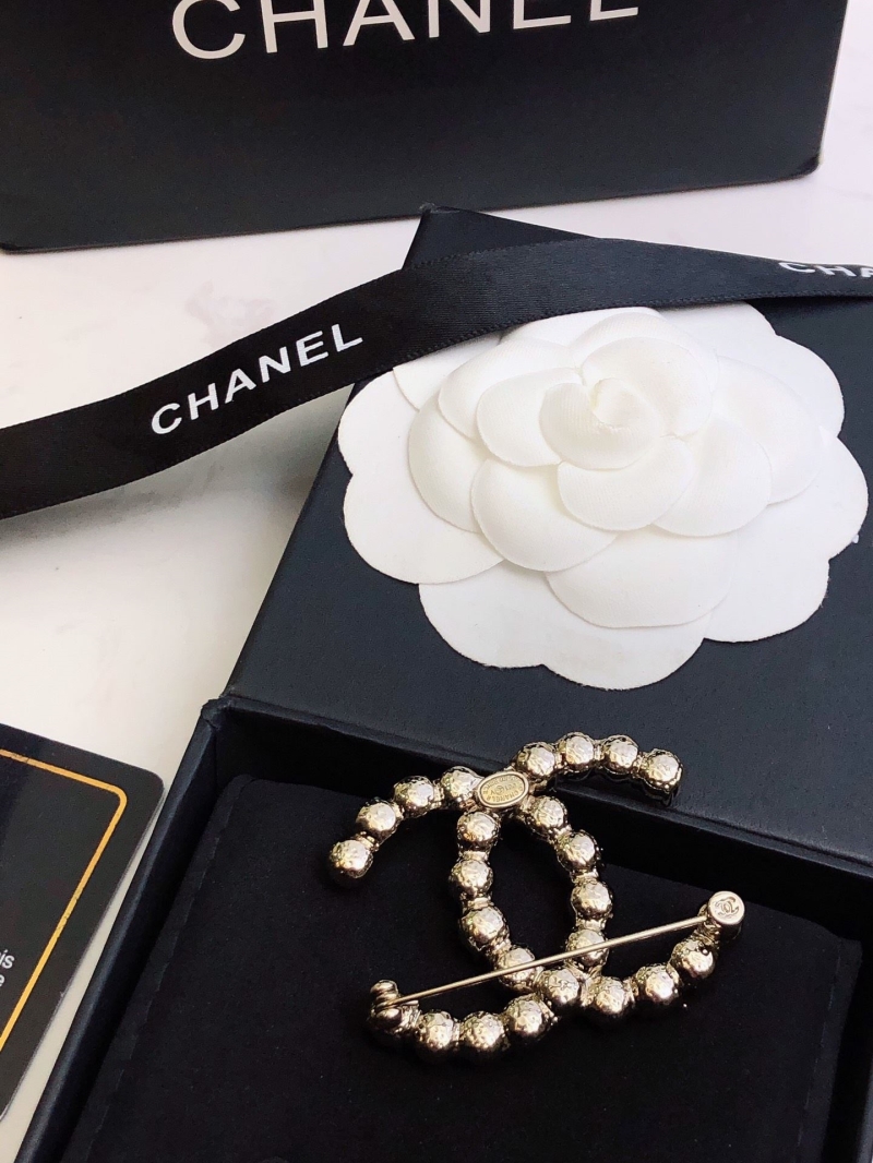 Ch**el brooches